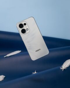 Stylish smartphone against a blue backdrop with floating feathers.